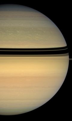 Springtime's Hues - (natural colors; credits: NASA)
Caption NASA:"New hues are creeping into Saturn's Northern Cloud Bands as Winter gives way to Spring there. 
During its first four years of exploration, Cassini has made the Saturn System a familiar place to us Earthlings. The intrepid craft has returned more than 150.000 images since arriving in orbit in mid-2004. In this natural color image, the blues and grays of Saturn's Northern Hemisphere, so striking in early Cassini images, are diminishing in intensity with the slow change of seasons on Saturn, and are almost imperceptibly being replaced by pale shades of the colors commonly seen by Cassini in the Planet's Southern Hemisphere. 
This view looks toward the sunlit side of the Rings from about less than 1° below the Ring-Plane. Images taken using red, green and blue spectral filters were combined to create this natural color view. The images were acquired with the Cassini Spacecraft wide-angle camera on April 23, 2008, at a distance of approx. 1,2 MKM (such as about 740.000 miles) from Saturn. 

Image scale is roughly 68 Km (about 42 miles) per pixel".
Parole chiave: Saturn