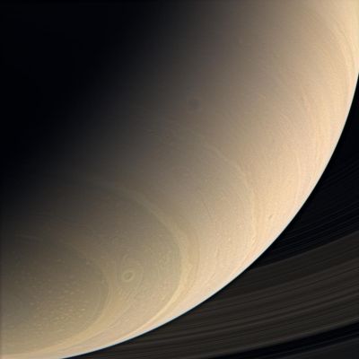 Saturn's South Polar Regions (near Natural Colors - elab. NASA)
Caption NASA:"The Cassini spacecraft views Saturn's Southern Latitudes in color, spying a great, eye-shaped vortex just northward of the South Polar Region. Other dark vortices, common features of Saturn's general circulation, are visible in the Mid-Latitudes. 
Contrast in the image was enhanced to make features in the atmosphere more visible. 

Images taken using red, green and blue spectral filters were combined to create this near-natural color view. The images were taken in visible light with the Cassini spacecraft wide-angle camera on Jan. 14, 2007 at a distance of approx. 958.000 Km  (such as about 595.000 miles) from Saturn. 
Image scale is roughly 54 Km (about 33 miles) per pixel".
Parole chiave: Saturn - Upper Atmosphere