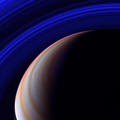 Deep Blue (IR view of the Rings)
The Cassini spacecraft surveys Saturn's outstretched Ring System in the infrared from a vantage point high above the Planet's Northern Latitudes. Nearly the full expanse of the main rings is visible here -- from the C-Ring to the outer edge of the A-Ring (in the upper left corner). 
Ring shadows are visible on the planet at lower left, and two large storms swirl near center. 
This view looks toward the unilluminated side of the Rings from about 52° above the Ring-Plane. 

The image was taken with the Cassini spacecraft wide-angle camera using a combination of spectral filters sensitive to wavelengths of infrared light centered at 752 (red channel), 890 (blue channel) and 728 (green channel) nanometers. 
The view was acquired on April 5, 2007 at a distance of approx. 1,4 MKM (about 900.000 miles) from Saturn. Image scale is roughly 81 Km (approx. 51 miles) per pixel.
Parole chiave: Saturn