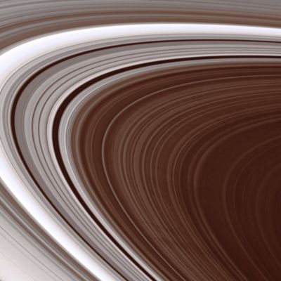 Spokes!
Caption NASA:"The Cassini Spacecraft spies multiple spokes in Saturn's outer B-Ring. The precise origin and evolution of these transient features continue to provide Ring Scientists with intriguing puzzles to solve. 
Most of these spokes are about 4000 Km long; the 2 near the bottom of the scene are about 1000 Km (about 600 miles) wide. 
This view looks toward the unilluminated side of the Rings from about 8° above the Ring-Plane. 

The image was taken in visible green light with the Cassini spacecraft narrow-angle camera on June 2, 2007. The view was acquired at a distance of approx. 2,2 MKM (such as about 1,4 MMs) from Saturn. 
Image scale is roughly 13 Km (about 8 miles) per pixel".
Parole chiave: Saturn's Rings - The "B-Ring"