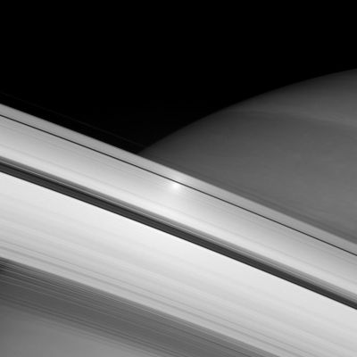 Surging Across the Rings
Caption NASA:"A surge in brightness appears on the Rings directly opposite the Sun from the Cassini Spacecraft. This "opposition surge" travels across the Rings as the Spacecraft watches. This view looks toward the sunlit side of the Rings from about 9° below the Ring-Plane. 

The image was taken in visible light with the Cassini spacecraft wide-angle camera on June 12, 2007 using a spectral filter sensitive to wavelengths of infrared light centered at 853 nanometers. 
The view was acquired at a distance of approx. 524.374 Km (such as about 325.830 miles) from Saturn. 
Image scale is 31 Km (about 19 miles) per pixel".
Parole chiave: Saturn