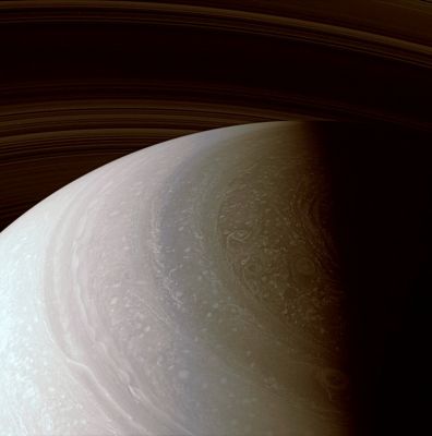 Northern Latitudes (possible natural colors; credits: Lunexit)
Caption NASA:"As seasons change on Saturn, and sunlight creeps farther north, the region surrounding the North Pole is steadily coming to light. This scene reveals many features in Saturn's dynamic and beautiful Atmosphere, including a detail largely obscured from the imaging cameras until now: on the Terminator at center right is part of the Polar Hexagon, which was previously observed by Cassini's Visible and Infrared Mapping Spectrometer (VIMS) and Composite Infrared Spectrometer (CIRS). 
These instruments used heat radiated from Saturn to observe the Polar Hexagon (rather than reflected sunlight, as is the case in this view). The Hexagon was first imaged by the Voyager spacecraft more than 25 years ago. 

The view looks toward the unilluminated side of the Rings from about 38° above the Ring-Plane and is centered on a region 63° north of the Saturnian Equator. 
The image has been brightened to show details at high Northern Latitudes, where solar illumination is presently weak. 

The image was taken with the Cassini spacecraft wide-angle camera on Jan. 2, 2008 using a combination of spectral filters sensitive to wavelengths of polarized infrared light centered at 752 and 705 nanometers. The view was acquired at a distance of approx. 930.000 Km (about 578.000 miles) from Saturn. 
Image scale is roughly 52 Km (approx. 32 miles) per pixel".
Parole chiave: Saturn