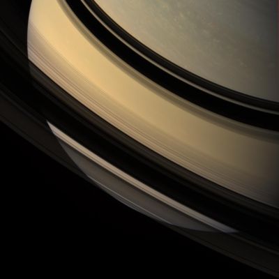 The Southern Hemisphere of Saturn (natural colors - credits: NASA/SSI)
Caption NASA:"Saturn's Southern Hemisphere is glimpsed through the Gossamer Veil of its Rings. Ring shadows adorn the low Northern Latitudes. 

This view looks toward the unilluminated side of the Rings from about 22° above the Ring-Plane. Images taken using red, green and blue spectral filters were combined to create this natural color view. 
The images were acquired with the Cassini spacecraft wide-angle camera on Dec. 16, 2007 at a distance of approx. 1,5 MKM (about 908.000 miles) from Saturn. 

Image scale is roughly 84 Km (approx. 52 miles) per pixel".
Parole chiave: Saturn