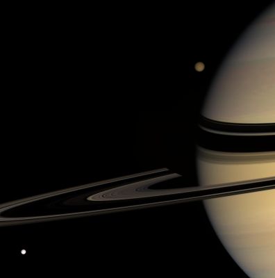 Never "Dark Nights"... (natural colors; credits: NASA)
Caption NASA:"Titan emerges from behind Saturn, while Tethys streaks into view, in this colorful scene. Saturn's shadow darkens the far arm of the Rings near the Planet's limb. Titan is about 5150 Km (approx. 3200 miles) wide; Tethys is 1071 Km (such as approx. 665 miles) wide. 
This view looks toward the unilluminated side of the Rings from about 3° above the Ring-Plane. Images taken using red, green and blue spectral filters were combined to create this natural color view. The images were acquired with the Cassini spacecraft wide-angle camera on Jan. 30, 2008 at a distance of approx. 1,3 MKM (such as about 800.000 miles) from Saturn. 
Image scale is roughly 77 Km (about 48 miles) per pixel on Saturn".
Parole chiave: Saturn, Titan and Tethys