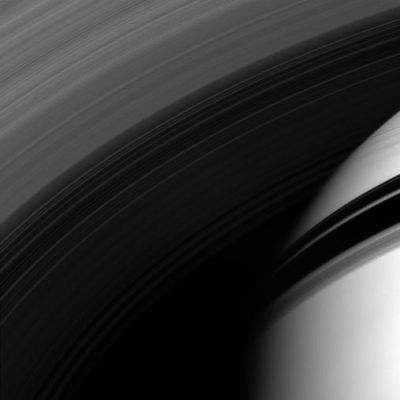 Through the Rings...
Caption NASA:"The Cassini spacecraft peers through the Gossamer Strands of Saturn's innermost rings, whose own shadows adorn the Planet beyond. 
This view looks toward the sunlit side of the rings from about 35° below the Ring-Plane. The image was taken in visible light with the Cassini Spacecraft wide-angle camera on April 21, 2008. The view was obtained at a distance of approximately 620.000 Km (approx. 385.000 miles) from Saturn. 
Image scale is roughly 67 Km (approx. 42 miles) per pixel".
Parole chiave: Saturn