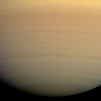 Southern Turbulence (natural colors; credits: NASA)
Caption NASA:"A line of vortices rolls through the turbulent region on Saturn nicknamed "Storm Alley" by Cassini scientists. This latitude band, centered around 35° South, has displayed persistent, intensive storm activity since Cassini began its approach to Saturn in early 2004. 

Images taken using red, green and blue spectral filters were combined to create this natural color view. The images were obtained with the Cassini Spacecraft wide-angle camera on July 23, 2008 at a distance of approximately 1 MKM (such as about 622.000 miles) from Saturn. 
Image scale is roughly 56 Km (about 35 miles) per pixel".
Parole chiave: Saturn - Southern Regions