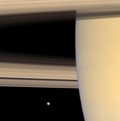 Saturn and Mimas (natural colors; credits: NASA/JPL/Space Science Institute )
Caption NASA:"The Cassini Spacecraft looks beyond Saturn's limb toward the icy face of Mimas, the innermost of the Planet's major moons. 
This view looks toward the sunlit side of the rings from about 3° below the Ring-Plane. Mimas is about 396 Km (approx. 246 miles) across. 

Images taken using red, green and blue spectral filters were combined to create this natural color view. The images were acquired with the Cassini Spacecraft narrow-angle camera on Sept. 4, 2007 at a distance of approx. 2,7 MKM (such as about 1,7 MMs) from Saturn and 2,8 MKM (such as about 1,8 MMs) from Mimas. 
Image scale is roughly 16 Km (about 10 miles) per pixel on Saturn and approx. 17 Km (such as about 11 miles) per pixel on Mimas". 
Parole chiave: Saturn and Mimas