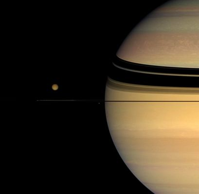 Many Colors for Many Moons... (natural colors; credits: NASA)
Caption NASA:"Four moons huddle near Saturn's multi-hued disk. 
The coloration of the planet's northern hemisphere has changed noticeably since the Cassini Spacecraft's arrival in orbit in mid-2004. Imaging scientists are working to understand the causes of this change, which is suspected to be a seasonal effect. 

Giant Titan (5150 Km, or approx. 3200 miles across), with its darker Winter Hemisphere, dominates the smaller moons in the scene. Beneath and left of Titan is Janus (181 Km, or about 113 miles across). Mimas (397 Km, or approx. 247 miles across) appears as a bright dot close to the Planet and beneath the Rings. Prometheus (102 Km, or about 63 miles across) is a faint speck hugging the Rings between the two small moons. 
This view looks toward the unilluminated side of the Rings from less than 1° above the Ring-Plane. 

Images taken using red, green and blue spectral filters were combined to create this natural color view. The view was acquired with the Cassini spacecraft wide-angle camera on Oct. 26, 2007, at a distance of approx. 1,5 MKM (such as about 920.000 miles) from Saturn and 2,7 MKM (about 1,7 MMs) from Titan. 
Image scale is roughly 89 Km (approx. 55 miles) per pixel on Saturn and 164 Km (about 102 miles) per pixel on Titan".
Parole chiave: Saturn and others Moons