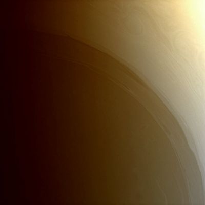 The South Pole of Saturn (natural colors; credits: Lunexit)
Caption NASA:"Long streamers of cloud encircle the South Polar Region of Saturn. Farther poleward, or toward lower left, faint, deeper atmospheric structures lurk beneath the haze. 
This image was acquired from a vantage point 74° South of the Planet's equator. 

The view was taken with the Cassini spacecraft wide-angle camera on Oct. 2, 2008 using a spectral filter sensitive to wavelengths of IR light centered at 728 nanometers. The view was obtained at a distance of approx. 369.000 Km (such as about 229.000 miles) from Saturn. 
Image scale is roughly 19 Km (about 12 miles) per pixel".
Parole chiave: Saturn - Upper Atmosphere - The South Pole