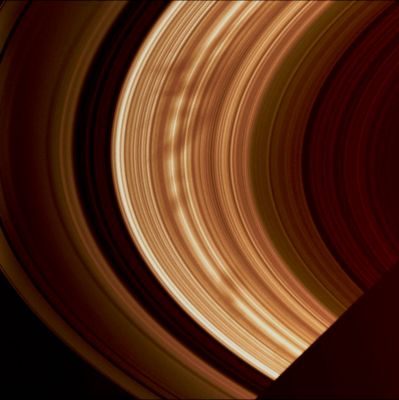 Spokes (natural - but enhanced - colors; credits: Lunar Explorer Italia)
Caption NASA:"A large group of Spokes emerges from Saturn's shadow in this image taken of the morning side of the Rings. Such groupings may hold clues to the manner in which these features are formed. 

The image was taken in visible light with the Cassini spacecraft wide-angle camera on Nov. 2, 2008 at a distance of approx. 869.000 Km (such as about 540.000 miles) from Saturn and at a Phase angle of 37°. 
Image scale is approx. 48 Km (such about 30 miles) per pixel".
Parole chiave: Saturn's Rings - The "A" and "B-Ring"