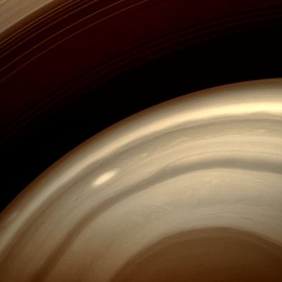 Southern Atmosphere (Natural Colors; credits: Lunar Explorer Italia)
Caption NASA:"A Cassini Spacecraft image captures a bright, oblong storm swirling high through the Middle Latitudes of the Southern Hemisphere. 
The image was taken through a spectral filter centered on wavelengths of light that are strongly absorbed by Methane gas. Hence, any light making it through this filter to the camera's detector has bounced off clouds that are high in the Atmosphere, making them visible, while light passing through the cloud-free surroundings gets absorbed by the Methane gas there before it reaches the lower clouds. 

The image was taken with the Cassini Spacecraft wide-angle camera on Jan. 5, 2009 using a spectral filter sensitive to wavelengths of near-InfraRed Light centered at 890 nanometers. The view was acquired at a distance of approx. 711.000 Km (such as about 442.000 miles) from Saturn and at a Sun-Saturn-Spacecraft, or Phase, Angle of 106°. 
Image scale is roughly 39 Km (about 24 miles) per pixel".
Parole chiave: Saturn - Upper Atmosphere