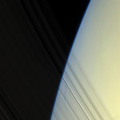 The C-Ring (Natural Colors; credits: NASA/JPL/Space Science Institute)
Caption NASA:"The Cassini Spacecraft peers through Saturn's delicate, translucent inner C-Ring to see the diffuse blue limb of Saturn's Atmosphere. 

This view looks toward the unilluminated side of the rings from about 20° above the Ring-Plane. Images taken using red, green and blue spectral filters were combined to create this Natural Color view. The images were obtained with the Cassini Spacecraft narrow-angle camera on April 25, 2008 at a distance of approx. 1,5 MKM (about 930.000 miles) from Saturn. 
Image scale is roughly 8 Km (approx. 5 miles) per pixel".
Parole chiave: Saturn