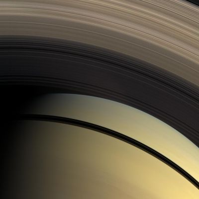 Transparencies (Natural Colors; credits: NASA/JPL/Space Science Institute)
Caption NASA:"This Natural Color view from the Cassini Spacecraft highlights the myriad gradations in the transparency of Saturn's inner Rings. 
The dark shadows of the Rings separate Saturn's Southern Hemisphere in the bottom of the image from the North. The innermost D-Ring is invisible, laid over the Planet's Northern Hemisphere. The translucent C-Ring runs through the middle of the image. The denser B-Ring stretches across the top of the image. 

This view looks toward the sunlit side of the Rings from about 48° below the Ring-Plane. Images taken using red, green and blue spectral filters were combined to create this Natural Color view. The images were acquired with the Cassini Spacecraft wide-angle camera on Feb. 28, 2009 at a distance of approx. 1 MKM (about 620.000 miles) from Saturn. 
Image scale is roughly 59 Km (approx. 37 miles) per pixel".
Parole chiave: Saturn