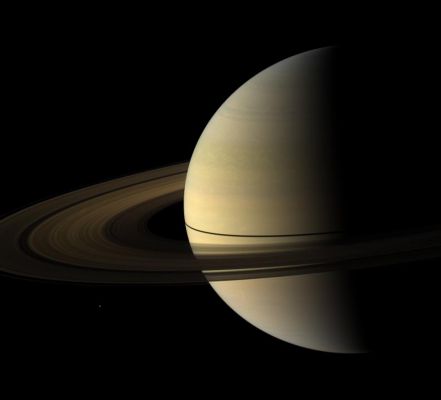 Post-Equinox Colors (Natural Colors; credits: NASA/JPL/Space Science Institute)
Caption NASA:"The Cassini Spacecraft captured this Natural Color View of Saturn almost a month after the Planet's August 2009 Equinox. The shadow cast on the Planet by the Rings remains narrow. 
Spokes are visible on the B-Ring. To learn more about these ghostly radial structures, see PIA11144. 

Mimas (approx. 396 Km, or about 246 miles across) can be seen in the lower left. Mimas and the Rings have been brightened relative to the Planet to increase visibility. 

The novel illumination geometry that accompanies Equinox lowers the Sun's angle to the Ring-Plane, significantly darkens the Rings, and causes out-of-plane structures to look anomalously bright and cast shadows across the Rings. These scenes are possible only during the few months before and after Saturn's Equinox, which occurs only once in about 15 Earth years. 

Before and after Equinox, Cassini's cameras have spotted not only the predictable shadows of some of Saturn's moons (see PIA11657), but also the shadows of newly revealed vertical structures in the Rings themselves (see PIA11665). 

This view looks toward the Northern, sunlit side of the Rings from about 10° above the Ring-Plane. 

The red, green and blue images that were mosaicked together to create this view were obtained with the Cassini Spacecraft wide-angle camera on Sept. 4, 2009. The view was obtained at a distance of approx. 2,7 MKM (such as about 1,7 MMs) from Saturn and at a Sun-Saturn-Spacecraft, or Phase, Angle of 92°. 
Image scale is roughly 156 Km (about 97 miles) per pixel".
Parole chiave: Saturn and Mimas