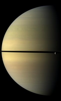 Crescent Saturn (Natural Colors; credits: NASA/JPL/Space Science Institute)
Caption NASA:"Saturn, stately and resplendent in this Natural Color view, dwarfs the icy moon Rhea. 
Rhea orbits beyond the Rings on the right of the image. The moon Tethys is not shown here, but its shadow is visible on the Planet on the left of the image. This view looks toward the Northern, sunlit side of the Rings from just above the Ring-Plane. 

Images taken using red, green and blue spectral filters were combined to create this Natural Color view. The images were obtained with the Cassini Spacecraft wide-angle camera on Nov. 4, 2009 at a distance of approx. 1,3 MKM (about 808.000 miles) from Saturn. 
Image scale is roughly 72 Km (about 45 miles) per pixel".
Parole chiave: Saturn