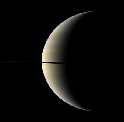 Eternal Vision (Natural Colors; credits: NASA/JPL/Space Science Institute)
Caption NASA:"A pastel crescent of Saturn is interrupted by the moon Mimas and the Rings in this color image. 
Mimas (approx. 396 Km - or about 246 miles across) appears as a dark speck just above the Rings. 
This view looks toward the Northern, sunlit side of the Rings, from just above the Ring-Plane. 

Images taken using red, green and blue spectral filters were combined to create this Natural Color view. The images were obtained with the Cassini Spacecraft wide-angle camera on Oct. 27, 2009 at a distance of approx. 2,2 MKM (such as about 1,4 MMs) from Saturn. 
Image scale is roughly 129 Km (approx. 80 miles) per pixel".
Parole chiave: Saturn and Mimas