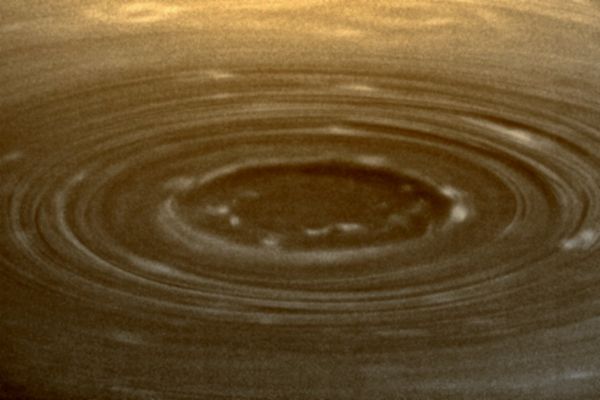 Southern Turbulence (natural colors; credits: Lunexit)
Caption NASA:"Shadows reveal the topography of Saturn's South Polar Vortex. At high resolution, a new, inner ring of isolated, bright clouds is seen. These clouds are localized regions of convective upwelling, an important clue to understanding how heat energy is transported in Saturn's Atmosphere. 
See PIA11104 for a high-resolution Cassini view that looks more directly down onto the vortex, compared to this oblique perspective. Sunlight illuminates the scene from upper right, and the higher altitude rings of clouds surrounding the pole cast shadows toward lower left. North on Saturn is up. 

The image was taken with the Cassini Spacecraft narrow-angle camera on July 15, 2008, with a combination of spectral filters sensitive to wavelengths of polarized infrared light centered at 746 and 938 nanometers. The grainy quality of the image is due primarily to the low signal-to-noise ratio of images taken with the 938 nanometer spectral filter, which is near the upper limit of the wavelength range the camera can see. "Signal-to-noise" is a term scientists use to refer to the amount of meaningful or useful information (signal) in their data versus the amount of background noise. A higher signal-to-noise ratio yields sharper, clearer views of features in the atmosphere. 
The view was acquired from 24° below the Ring-Plane, at a distance of approx. 778.000 Km (about 483.000 miles) from Saturn. 
The Sun-Saturn-Spacecraft, or Phase, Angle is about 30°. 
Image scale is 4 Km (about 3 miles) per pixel".
Parole chiave: Saturn - Upper Atmosphere - The South Pole