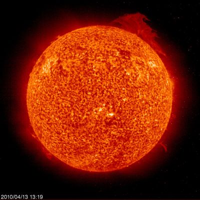 Solar Prominence
Caption NASA:"What's that coming over the edge of the Sun? What might appear at first glance to be some sort of Sun monster is actually a Solar Prominence. The above Prominence, captured by the Sun-orbiting SOHO satellite earlier this year during an early stage of its eruption, rapidly became one of the largest ever on record. 
Even as pictured, the Prominence is huge -- the Earth would easily fit inside. A Solar Prominence is a thin cloud of Solar Gas held just above the Surface by the Sun's Magnetic Field. 
A "Quiescent Prominence" typically lasts about a month, while an "Eruptive Prominence" like the one developing above may erupt within hours into a Coronal Mass Ejection (CME), expelling hot gas into the Solar System. Although very hot, Prominences typically appear dark when viewed against the Sun, since they are slightly cooler than the surface. As our Sun evolves toward Solar maximum over the next three years, more large eruptive prominences are expected".
Parole chiave: The Sun from Space