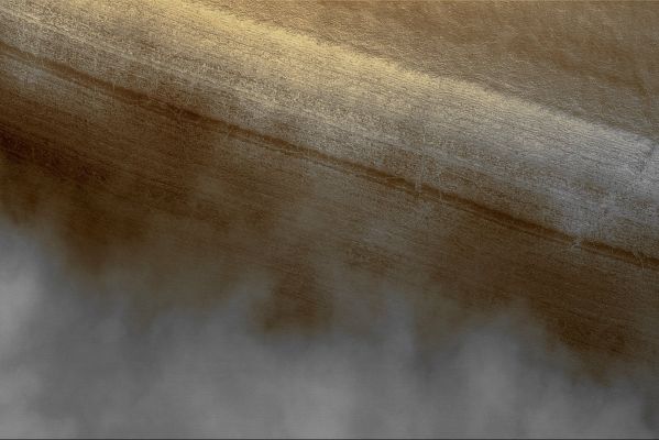 Fog over Chasma Australe (Absolute Natural Colors; credits for the additional process. and color: Dr Paolo C. Fienga - Lunexit Team)
Caption NASA originale:"Fog is a common occurrence in some areas of the retreating South Polar Seasonal Frost Cap. Fogs are commonly banked-up against steep Slopes or found inside Defrosting Craters. 
This MGS-MOC image captured mid-afternoon Fog banked against the Layered Walls of Chasma Australe, a Trough in the South Polar Region of Mars. The Frost-covered Layers of Chasma Australe can be seen on the right side of this image, while the billowy Fog is to the left. 
Sunlight illuminates this scene from the upper left. The Fog, probably composed of water ice crystals, casts shadows on the Chasm's Wall. 

This picture is located near 83,5° South Lat. and 257,9° West Long; it covers an area about 3 Km (1.9 mi) wide". 
Parole chiave: Mars from orbit - South Polar Regions - Chasma Australe