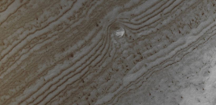South Polar Features: Layered Knob (Natural Colors; credits for the additional process. and color.: Dr Paolo C. Fienga - Lunexit Team)
Caption NASA originale:"This MGS-MOC image shows a small, relatively light-toned Knob of Layered Material and the erosional expression of the underlying layers, in the South Polar Region of Mars. When the image was acquired in April 2005, the surface was still covered with seasonal carbon dioxide frost. Dark spots and streaks mark locations where the frost had begun to change and sublime away". 

Location near: 84,2° South and 138,3° West
Image width: ~3 Km (~1,9 mi) 
Illumination from: upper left 
Season Southern Spring 
Parole chiave: Mars from orbit - South Polar Features - Layered Knob