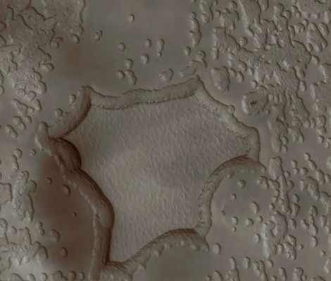 Sublimation at the South Polar Residual Cap (Absolute Natural Colors; credits: Dr Paolo C. Fienga - Lunexit Team)
Caption NASA:"This MGS-MOC image shows a portion of the South Polar Residual Cap where the effects of Sublimation are apparent. 
Over extended periods of time, Sublimation "eats" away at the smoother appearing material (largely composed of frozen CO2), darkening the Scarps and creating the irregularly shaped depressions that are present throughout much of the scene".

Location near: 87,1° South Lat. and 69,3° West Long.
Image width: ~3 Km (~1,9 miles) 
Illumination from: upper left 
Season: Southern Summer
Parole chiave: Mars from orbit - South Polar Features - Effects of Sublimation
