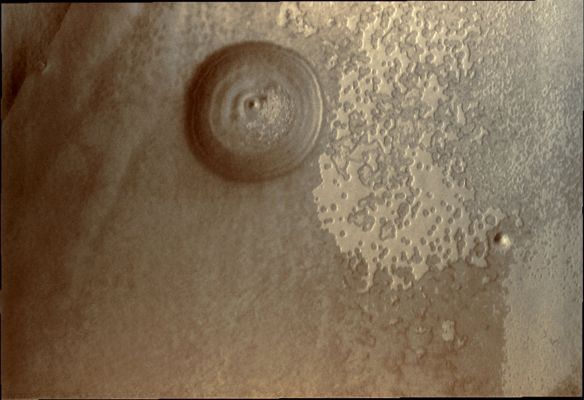 Exhumed South Polar Crater (Natural Colors; credits for the additional process. and color.: Dr Paolo C. Fienga - Lunar Explorer Italia)
Caption NASA:"The Sun has risen over the South Pole of Mars as Southern Spring gets underway. The Surface of the Polar Cap and its surroundings will undergo extensive change as frost and ice sublimate in the Sun".

Coord.: 86,8° South Lat. and 248,3° East Long.
Parole chiave: Mars from orbit - Craters - Unnamed Crater in the South Polar Cap