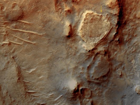 Gusev Crater and Spirit: Aerial View
Caption NASA:"Clear skies and low-angle sunlight are an outdoor photographer's dream. On the shortest day of Martian winter, June 24, 2008, Spirit had both. Conditions were ideal for an orbiter's shot of the Mars Rover parked on the sunlit slope of a volcanic plateau. 
Shadows outlined shapes in the landscape, such as the upturned edges of the bowl-shaped plateau known as "Home Plate". Shadows also reveal nearby ridges, slopes, and large boulders. Spirit is the dark "bump", marked by a yellow arrow. 

Detailed images such as this one will help scientists select a future path for Spirit. For plotting a path on Mars, a powerful orbiting camera, long shadows, and a clear sky are about as good as it gets".
Parole chiave: Mars from orbit - Gusev Crater Region