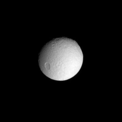 Icy Impact: the Odysseus Basin on Tethys
Caption NASA:"The enormous Impact Basin Odysseus sits on the Eastern Limb of icy Tethys. 
This view looks toward the Anti-Saturn side of Tethys and North is toward the top of the picture. 

The image was taken with the Cassini Spacecraft narrow-angle camera on April 14, 2008 using a spectral filter sensitive to wavelengths of ultraviolet light centered at 338 nanometers. The view was obtained at a distance of approx. 1,1 MKM (such as about 714.000 miles) from Tethys and at a Phase Angle of 26°. 
Image scale is roughly 7 Km (about 4 miles) per pixel".
Parole chiave: Saturn's Moons - Tethys