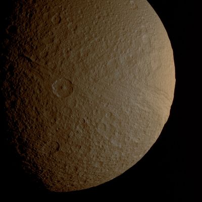 Ithaca Chasma (natural colors - MULTISPECTRUM; credits: Lunexit)
Caption NASA:"The prominent crater Telemachus sits within the northern reaches of Ithaca Chasma on Saturn's moon Tethys. 
Ithaca Chasma is an enormous rift that stretches more than 1000 Km (approx. 620 miles) from North to South across Tethys. 

This view looks toward the Saturn-facing Side of Tethys from a position 55° North of the moon's Equator. The image was taken in visible light with the Cassini Spacecraft narrow-angle camera on Sept. 24, 2008. 
The view was acquired at a distance of approx. 151.000 Km (such as about 94.000 miles) from Tethys and at a Sun-Tethy-Spacecraft, or Phase, Angle of 61°. 
Image scale is 903 meters (2962 feet) per pixel".
Parole chiave: Saturn's Moon - Tethys