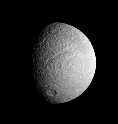 The Odyssey on Tethys...
Caption NASA:"This Cassini Spacecraft image provides a view of the southern portion of Tethys' Trailing Hemisphere. 
Prominent features include the huge canyon, Ithaca Chasma, approximately centered in this view, as well as Demodocus and Telemus, large basins just to the right of the rift. 
Features on Tethys are named for characters in Homer's Odyssey. 

The image was taken in visible green light with the Cassini Spacecraft narrow-angle camera on Oct. 10, 2008 at a distance of approx. 417.000 Km (about 259.000 miles) from Tethys and at a Sun-Tethys-Spacecraft, or Phase, angle of 55°. 
Image scale is roughly 2 Km (a little more than 1 mile) per pixel".
Parole chiave: Saturn's Moon - Tethys