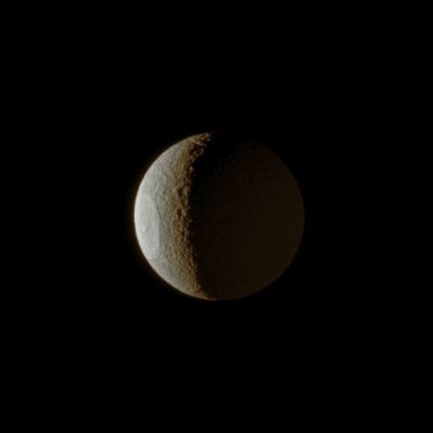 Between Sunshine and Saturnshine (Natural Colors; credits: Lunar Explorer Italia)
Caption NASA:"The huge Odysseus Crater is clearly illuminated by the Sun on the Western Limb (Sx) of Tethys, but Saturn - shining from the right - makes the smaller craters on the Eastern part of the moon also visible. 
The ancient Odysseus Crater is 450 Km, or about 280 miles, across and covers a sizable chunk of the moon. North on Tethys is up and rotated 31° to the left. 
This view looks toward the Saturn-facing side of the moon. 

The image was taken in visible light with the Cassini Spacecraft narrow-angle camera on Jan. 22, 2009. The view was acquired at a distance of approx. 793.000 Km (such as about 493.000 miles) from Tethys and at a Sun-Tethys-Spacecraft, or Phase, Angle of 112°. 
Image scale is roughly 5 Km (a little more than 3 miles) per pixel".
Parole chiave: Saturn's Moons - Tethys