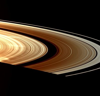 Bright Spokes (Natural Colors; credits: Lunar Explorer Italia)
Caption NASA:"Signaling a return to the bright Spokes first encountered by the Cassini Spacecraft in 2005, three large white Spokes stretch out across the B-Ring. Throughout most of the last year, Cassini captured views of dark Spokes. 
This image of bright Spokes was taken Jan. 14, 2009 in Visible Light with the Spacecraft's wide-angle camera.
The small moon Atlas (about 30 Km, or approx. 19 miles across) has been brightened by 30% but still appears as a faint dot between the A and F Rings in the top right quadrant of the image. 

This view looks toward the sunlit side of the Rings from about 6° below the Ring-Plane. The view was acquired at a distance of approx. 551.000 Km (about 342.000 miles) from Saturn and at a Sun-Saturn-Spacecraft, or Phase, Angle of 155°. Image scale is roughly 29 Km (such as about 18 miles) per pixel".
Parole chiave: Saturn - Upper Atmosphere