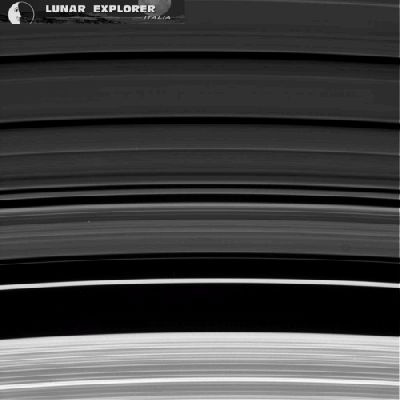 In the Rings (a GIF-Movie by Dr Gianluigi Barca - Lunar Explorer Italia/Italian Planetary Foundation)
Since all the Beauties of the Universe in general - as well as many of the ones of our Solar System in particular - cannot always be adequately understood nor explained (and, please, forgive us if and when we say that those who state and declare that today's Science can really explain everything, in our opinion, as IPF, do not have the least idea of what they are talking about...), we have learned that, sometimes, and in front of certain phenomena which, as we just said, are not only impossible to recreate but (and for now), are also impossible to be observed from a REALLY close distance (thus making them extremely difficult to be fully understood and therefore explained in a satisfying way), it is Science itself that calls for some speculation. 
This small foreword was absolutely necessary because the very few lines that shall follow (and which relate to the possible origin of Saturn's Rings) are, in our humble opinion, almost pure Scientific Speculation. Yes, of course we know that the hypothesis which we shall try to illustrate do represent an "informed Scientific Speculations", but still we have no actual proof (and, likely, we shall never have it) that even one of them is correct, either in full or just in part. 
Given all that, we can start by saying that, according to several (either recent and/or less recent) Theories, the Rings of Saturn should be EXTREMELY old, meaning that they could be dating to the formation of Saturn (as well as of the whole Solar System) itself. Furthermore (and as a matter of fact), nowadays there are just 2 (two) Main Theories regarding the origin of Saturn's Rings which are thought to be sufficiently believable: the first one, originally proposed by the French Astronomer Édouard Robert Roche in the 19th Century, is that the Rings were once a moon of Saturn (named "Veritas", after a Roman Goddess) whose orbit, for (obviously...) unknown reasons, decayed (however, we suggest, as IPF and among many other possibilities, the occurrence of a powerful impact, that was strong enough to disrupt Veritas' orbit but NOT to disintegrate - at least, not entirely - the moon itself), until the moon came close enough to its Parent Planet so to be litterally ripped apart by the Saturnian Tidal Forces (in other words, and assuming that this Theory is basically correct, "Veritas" must have been some sort of a "Rubble-pile moon", such as a Celestial Body which was so fragile that it could not pass the so-called "Roche Limit" without being - almost - completely disintegrated). A variation of this first Main Theory (a variation that, however, we believe - as IPF - to be extremely unlikely) is that the "Veritas" moon simply disintegrated after being struck by a large Comet or an Asteroid. 
The second Main Theory is that the Rings of Saturn were never part of a moon, but they are, instead, some physical leftovers of the original Proto-Planatary Nebula (i.e.: Nebular-like Material) from which Saturn itself was formed.
Parole chiave: GIF-Movies - Saturn's Rings