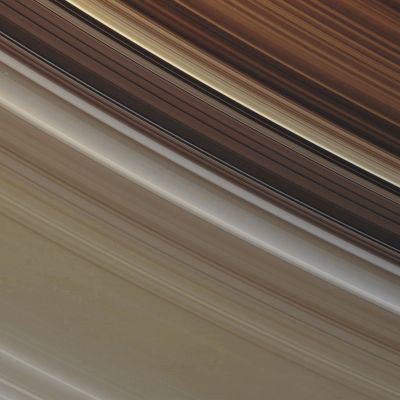 The beautiful and colorful Rings of Saturn (Absolute Natural Colors; credits for the additional process. and color.: Dr Paolo C. Fienga - Lunar Explorer Italia/Italian Planetary Foundation) 
This is a spectacular view - obtained by the NASA - Cassini Spacecraft - that shows us the subtle golden and gray/whitish colors which characterize the Outer B-Ring, the Cassini Division and the inner part of the A-Ring of the Giant Gas-Planet Saturn. In this viewing geometry, the brightest feature in the Cassini Division is the (relatively) recently discovered diffuse Ringlet which lies near the Outer Edge of the Division (and this diffuse Ringlet shows a quite peculiar bluish cast). The colors of the Rings, as they look in this picture, appear more golden than ever because of the Viewing Geometry that was adopted: as a matter of fact, an increased scattering in the ice and rock particles forming the Rings was brought about not only by the high Phase Angle (such as the angle drawn and defined by the Sun, the Rings and the NASA - Cassini Spacecraft), but also by the circumstance that this view was obtained while the Spacecraft was watching towards the Unlit Side of the Rings, from about 30° above the Ring-Plane. The images used to create this frame were acquired by the NASA - Cassini Spacecraft narrow-angle camera on Sept. 29, 2006, at a distance of approx. 1,8 MKM (about 1,13 MMs) from the Rings of Saturn and the image scale is roughly 11 Km (such as about 7 miles) per pixel.
Remember that the NASA - CASSINI Original b/w frame has been additionally processed and then re-colorized, according to an informed speculation carried out by Dr Paolo C. Fienga (LXTT-IPF), in Absolute Natural Colors (such as the colors that a human eye would actually perceive if someone were onboard the NASA - Cassini Spacecraft and then looked outside, towards the Rings of Satun), by using an original technique created - and, in time, dramatically improved - by the Lunar Explorer Italia Team. Different colors, as well as different shades of the same color, mean, among others, the existence of different Elements in the Rings of Satun, each having a different Albedo (---> Reflectivity) and Chemical Composition.
Parole chiave: Saturn - The Rings