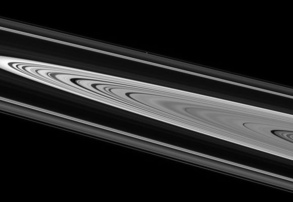 Sidelong View
Caption NASA:"Saturn's enchanting rings display crisply defined edges and strong contrast on their unilluminated side. Atlas (32 Km, or about 20 miles across) sits on the far side of the Rings above center, between the "A" and "F" Rings. This view was acquired from about 1° above the Ring-Plane. 

The image was taken in visible light with the Cassini spacecraft narrow-angle camera on June 21, 2007 at a distance of approx. 2,4 MKM (about 1,5 MMs) from Atlas. Image scale is roughly 14 Km (about 9 miles) per pixel".
Parole chiave: Saturn's Rings