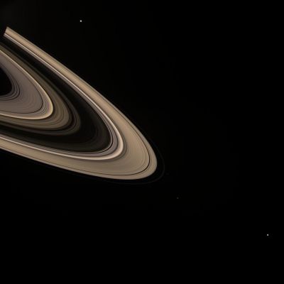 The Golden Rings of Saturn and some of His Moons... - (natural colors; credits: NASA)
Caption NASA:"A color portrait of Saturn's sunlight-scattering Rings hosts a group of several moons. 
Enceladus (505 Km, or 314 miles across) is visible at top. At bottom, in increasing distance from the Rings, are Pandora (84 Km, or 52 miles across), Janus (181 Km, or 113 miles across) and Mimas (397 Km, or 247 miles across). 
This view looks toward the unilluminated side of the Rings from about 10° above the Ring-Plane. Saturn's shadow can be seen on the Rings at upper left. 

Images taken using red, green and blue spectral filters were combined to create this composite color view. 

The images were taken with the Cassini spacecraft wide-angle camera on Dec. 22, 2007. The view was acquired at a distance of approx. 1,8 MKM (such as about 1,1 MMs) from Saturn. Image scale is about 110 Km (approx. 68 miles) per pixel". 
Parole chiave: Saturn's Rings & Companions