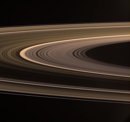 Rings Aglow (natural colors; credits: NASA)
Caption NASA:"Saturn's softly glowing Rings shine in scattered Sunlight. The B-Ring presents a remarkable difference in brightness between the near and far arms (bottom and top of the image, respectively). The strong variation in brightness could be due to the presence of wake-like features in the B-Ring. 

This view looks toward the unilluminated side of the Rings from about 5° above the Ring-Plane. Images taken using red, green and blue spectral filters were combined to create this natural color view. The images were acquired at a distance of approx. 574.000 Km (about 357.000 miles) from Saturn.

At the center of the image, the Sun-Ring-Spacecraft Angle - or Phase Angle - is 114°, and the image scale is roughly 34 Km (about 21 miles) per pixel in the radial, or outward from Saturn, direction".

Nota Lunexit: ATTENZIONE! La NASA, riteniamo con questo frame, ha finalmente iniziato a fornire qualche dettaglio in più allorchè vengono comunicate al Pubblico delle info le quali, in sè, e laddove non adeguatamente precisate, finivano con il dire poco: si tratta del punto di riferimento del frame considerato per il calcolo dell'Angolo di Fase (che è il suo centro) e la direzione di riferimento del frame in ordine alla Scala pixel/Km. Non male, considerato che avevamo iniziato proprio noi, circa tre anni fa, a dare informazioni contestuali di supporto a svariati frames NASA-CASSINI (non queste info, comunque).
Parole chiave: Saturn's Rings