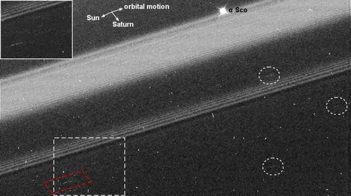 Saturnian "Propellers" (context frame)
The Cassini spacecraft captures 8 new propeller-like features within Saturn's A-Ring in what may be the propeller "hot zone" of Saturn's Rings. 
Propeller features form around small moonlets that are not massive enough to clear out ring material, but are still able to pull smaller ring particles into a shape reminiscent of an airplane propeller. Scientists believe that propellers represent moonlet wakes, which are denser than the surrounding ring material and appear bright in the images. 
Propellers were first discovered in Cassini images taken during Saturn orbit insertion in 2004. This new image is from a more extensive study of the full A-Ring and provides evidence that these features are not distributed evenly as previously thought, but are instead grouped in a 3000 Km-wide (about 1860 mile) Propeller Belt.


The largest propeller seen here is noted in the white dashed box, and it indicates the presence of a 150-meter (490-foot) moonlet. The size is inferred from the radial separation of the propeller wings. The propeller is seen in another image and is shown in the upper left box. 
The reappearance of the propellers clearly demonstrates their orbital motion.
Parole chiave: Saturn - Propellers