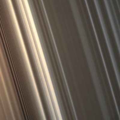 "Spiral Density Wave" in the B-Ring (MULTISPECTRUM; credits: Lunexit)
Caption NASA:"This High-Resolution view shows, at left, a Spiral Density Wave (SDW) in Saturn's inner B-Ring. A SDW is a spiral-shaped massing of particles that tightly winds many times around the Planet. These waves decrease in wavelength with increasing distance from the Planet. 
Scientists use images like this one to understand the mass of the Rings and the collisional dynamics of the Ring Particles. 

The view looks toward the sunlit side of the Rings from about 50° below the Ring-Plane. The image was taken in visible light with the Cassini Spacecraft narrow-angle camera on May 10, 2008. The view was obtained at a distance of approx. 279.000 Km (sich as about 173.000 miles) from Saturn. 
Image scale is roughly 1 Km (0,6 mile) per pixel".
Parole chiave: Saturn's Rings - The B-Ring