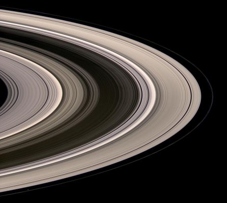 In the Sunlight... (natural colors; credits: NASA)
Caption NASA:"Saturn's icy Rings shine in scattered sunlight in this view, which looks toward the unilluminated northern side of the Rings from about 15° above the Ring-Plane. The Sun currently illuminates the Rings from the South. Some of the sunlight not reflected from the Rings' southern face is scattered through the countless particles, setting the Rings aglow. The inner F-Ring shepherd moon Prometheus (86 Km, or about 53 miles across at its widest point) appears at lower left. 

Images taken using red, green and blue spectral filters were combined to create this natural color view. Bright clumps of material in the narrow F-Ring moved in their orbits between each of the color exposures, creating a chromatic misalignment in several places that provides some sense of the continuous motion within the Ring System. 
The images were obtained with the Spacecraft wide-angle camera on July 4, 2008 at a distance of approx. 1,2 MKM (about 770.000 miles) from Saturn. The Phase Angle was 28°.

Image scale is roughly 70 Km per pixel".
Parole chiave: Saturn's Rings
