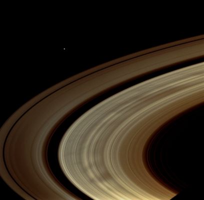 Spokes in the "B-Ring" (possible True Colors; credits: Lunar Explorer Italia)
Caption NASA:"Broad, dark spokes in the B-Ring are clearly seen in this image of Saturn's Rings. The spokes are finally becoming quite common, as they were during the Voyager flybys. These observations and others like it seem to support the idea that the spokes become most prominent near the Saturnian Equinox. Also visible in this image is the moon Janus off beyond the Rings. 

The image was taken in visible light with the Cassini Spacecraft wide-angle camera on Oct. 19, 2008 at a distance of approx. 1,1 MKM (such as about 628.000 miles) from Saturn and at a Phase Angle of 29°. 
Image scale is roughly 57 Km (about 35 miles) per pixel".
Parole chiave: Saturn's Rings - The "A" and "B-Ring"