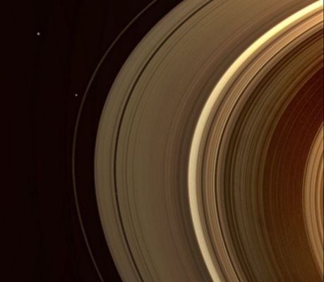 Fantastic View (possible True Colors; credits: Lunar Explorer Italia)
Caption NASA:"Three of Saturn's satellites are visible in this snapshot from the Cassini Spacecraft. Janus (approx. 179 Km, or about 111 miles across) is in the top left of the image. Pandora (approx. 81 Km, or about 50 miles across) is just outside the F-Ring and Pan (approx. 28 Km, or about 17 miles across) is the small moon that has cut a path inside the Rings below the center of the image. 

This view looks toward the unilluminated side of the Rings from about 27° above the Ring-Plane. The image was taken in visible light with the Cassini Spacecraft wide-angle camera on Dec. 7, 2008 using clear filters: CL1 (635 nm) and CL2 (635 nm). It was obtained from a distance of approx. 1 MKM (such as about 641.000 miles) from Pan and at a Sun-Pan-Spacecraft, or Phase, Angle of 33°. Image scale is roughly 62 Km (about 38 miles) per pixel".
Parole chiave: Saturn's Rings and Companions