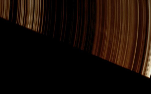 Ghostly Spokes (Natural Colors; credits: Lunar Explorer Italia)
Caption NASA:"Faint, ghostly Spokes dapple the dark side of Saturn's A-Ring as the Planet's shadow makes a sharp diagonal cut across this image from Cassini. 

The image was taken in Visible Light with the Cassini Spacecraft wide-angle camera on April 30, 2008. 
This view looks toward the unilluminated side of the rings from about 26° above the Ring-Plane. The view was obtained at a distance of approx. 316.000 Km (such as about 196.000 miles) from Saturn and at a Sun-Saturn-Spacecraft, or Phase, Angle of 147°. Image scale is roughly 15 Km (about 9 miles) per pixel".
Parole chiave: Saturn's Rings