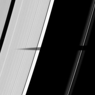Shadow on the Rings
Caption NASA:"The shadow of the moon Mimas extends elegantly across Saturn's A and F-Rings. As Saturn approaches its August 2009 Equinox, the Planet's moons cast shadows onto the rings. To learn more about this special time and to see a movie of a moon's shadow moving across the Rings, see also PIA11651. Two background stars are visible in the image. Mimas is not shown. 

This view looks toward the sunlit side of the rings from about 62° below the Ring-Plane. The image was taken in Visible Light with the Cassini Spacecraft narrow-angle camera on April 7, 2009. The view was acquired at a distance of approx. 1,1 MKM (such as about 684.000 miles) from Saturn and at a Sun-Saturn-Spacecraft, or Phase, Angle of 101°. 
Image scale is roughly 6 Km (a little more than 4 miles) per pixel".
Parole chiave: Saturn's Rings