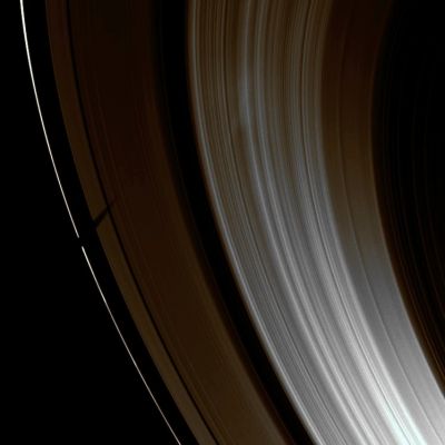 Shadow on the Rings (Natural Colors; credits: Lunar Explorer Italia)
Caption NASA:"Saturn's moon Tethys casts a wide shadow over the Planet's "F" and "A"-Rings. 
Tethys itself is not visible in this image. As Saturn approaches its August 2009 Equinox, the planet's moons cast shadows onto the Rings. To learn more about this special time and to see a movie of a moon's shadow moving across the Rings, see also PIA11651. 

This view looks toward the sunlit side of the rings from about 36° below the Ring-Plane. 
The image was taken in Visible Light with the Cassini Spacecraft wide-angle camera on April 21, 2009. The view was obtained at a distance of approx. 1,1 MKM (such as about 684.000 miles) from Saturn and at a Sun-Saturn-Spacecraft, or Phase, Angle of 142°. 
Image scale is roughly 63 Km (about 39 miles) per pixel".
Parole chiave: Saturn's Rings