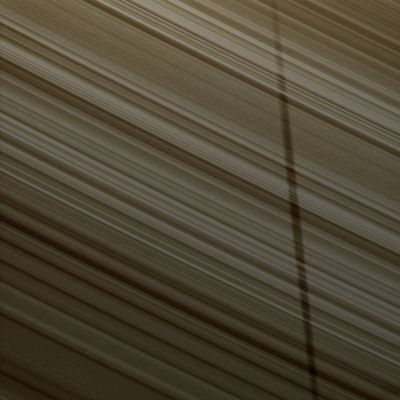 Shadows on the "B"-Ring (Natural Colors; credits: Lunar Explorer Italia)
Caption NASA:"The shadow of the moon Epimetheus stretches across the B-Ring in this image taken by Cassini as Saturn approaches its 2009 Equinox. The novel illumination geometry created as Saturn approaches its August 2009 Equinox allows moons orbiting in or near the plane of Saturn's Equatorial Rings to cast shadows onto the Rings. 
These scenes are possible only during the few months before and after Saturn's Equinox, which occurs only once in about 15 Earth years. 
This view looks toward the sunlit side of the rings from about 42° below the Ring-Plane. 

The image was taken in Visible Light with the Cassini Spacecraft narrow-angle camera on June 8, 2009. The view was obtained at a distance of approx. 700.000 Km (about 435.000 miles) from Saturn and at a Sun-Saturn-Spacecraft, or Phase, Angle of 129°.
Image scale is roughly 4 Km (about 2,5 miles) per pixel".
Parole chiave: Saturn's Rings - "B" Ring