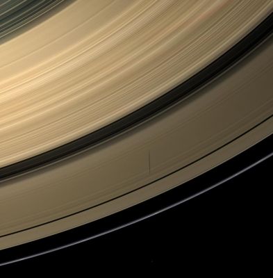 Within the Rings (Natural Colors; credits: NASA/JPL/Space Science Institute)
Caption NASA:"Saturn's moon Epimetheus casts a shadow across the colourful Rings of Saturn, in this image taken before the Planet's August 2009 Equinox. 
Epimetheus (approx. 113 Km, or about 70 miles across) is visible as a small dot at the center of the bottom of the image. 

The novel illumination geometry that accompanies Equinox lowers the Sun's angle to the Ring-Plane, significantly darkens the Rings, and causes out-of-plane structures to look anomalously bright and cast shadows across the Rings. These scenes are possible only during the few months before and after Saturn's Equinox, which occurs only once in about 15 Earth years. Before and after Equinox, Cassini's cameras have spotted not only the predictable shadows of some of Saturn's moons (see PIA11657), but also the shadows of newly revealed Vertical Structures in the Rings themselves (see PIA11665). 

Images taken using red, green and blue spectral filters were combined to create this Natural Color view. This view looks toward the southern, sunlit side of the Rings from about 39° below the Ring-Plane. 
The images were obtained with the Cassini Spacecraft wide-angle camera on June 8, 2009 at a distance of approx. 725.000 Km (about 450.000 miles) from Saturn. 
Image scale is roughly 40 Km (about 25 miles) per pixel".
Parole chiave: Saturn's Rings - "B" Ring