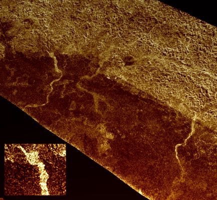 Xanadu's Channels (false colors; credits: Lunexit)
On the final flyby of Cassini's original 4-year tour, its radar mapper captured these unusual channels on Titan at the edge of Xanadu, the widest seen in this area (For a radar image of Xanadu, see PIA08428). These might be active rivers carrying methane or debris, or they might be dry riverbeds similar to earthly "arroyos". 

Past Cassini radar images have revealed different types of channels on Titan's surface (see PIA03565 and PIA07366). They vary from bright to dark in radar (rough to smooth), and from fan-shaped to braided to meandering. 
Some, drain into lakes; others disappear. Some of these channels may be several hundred meters, or feet, deep. 

This image, taken from the flyby on May 28, 2008, shows the border of Xanadu as the bright-dark boundary running from the upper left to lower right. Southward from that boundary is an unusual set of channels. While these are brighter (more roughly textured) than the surrounding terrain, some are only slightly brighter, and some are as wide as 5 Km (about 3 miles) — about the size of the River Thames at its mouth east of London. 

They appear to flow out of the rough Region of Xanadu. 

Careful inspection reveals smaller tributaries that wind through the brighter and apparently rougher terrain to the north. A close-up of one of the widest channels is shown at the lower left. 

Scientists think that many of the channels on Titan are carved by methane deposited on the surface from strong but infrequent rainstorms. A bright channel may be dry, with the rough riverbed of icy particles (like those seen at the Huygens Landing Site) producing the radar brightness. The darker channels in this image resemble the dry lakes seen in the North Polar area of Titan, so they may be dry as well, with their smoother (radar-dark) surfaces caused by finer-grained sediment deposits on the channel floors. 

This image shows an area located at 15° South Latitude and 121° West Longitude. It is about 450 Km (about 280 miles) across, and has approximately 1 Km (0,62-mile) resolution. 
North is up.
Parole chiave: Saturn's Moon - Titan