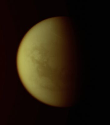 Bright Northern Clouds on Titan (natural colors; credits: Lunexit)
Caption NASA:"Bright clouds circumscribe Titan's North Polar Region: a frigid land of Methane Seas. 
The clouds seen in this image and other recent Cassini Spacecraft views are at higher latitudes than similar streak-like clouds observed in the Southern Hemisphere (see PIA08966). Scientists are working to understand why such clouds appear preferentially at certain latitudes on Saturn's largest moon. 
While the streaks that grace Titan's Southern Hemisphere are often seen at 40° South Latitude, similar to Wellington, New Zealand, the streaks in the Northern Hemisphere are farther from the Equator, near 56° North Latitude, which is similar to Glasgow, Scotland. North on Titan is up and rotated 16° to the right. 

The image was taken with the Cassini spacecraft narrow-angle camera on Sept. 30, 2008 using a spectral filter sensitive to wavelengths of infrared light centered at 938 nanometers. The view was obtained at a distance of approx. 1,2 MKM (such as about (776.000 miles) from Titan and at a Sun-Titan-Spacecraft, or Phase, angle of 71°. 
Image scale is 7 Km (about 4,5 miles) per pixel".
Parole chiave: Saturn's Moon - Titan