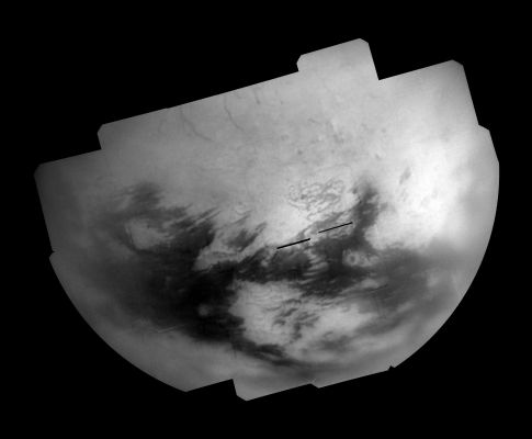 A new "Ortographic View" of Titan
Bright and dark terrains on Titan's Trailing Hemisphere are revealed by Cassini's Imaging Science Subsystem in this mosaic of images taken during the T28 flyby in April 2007. The Region shown in this image, centered on the northern part of Titan's Trailing Hemisphere (near 31,2° North and 220,7° West), had only been seen at very low resolution until February 2007, when Cassini flew over this area for the first time. This mosaic consists of images taken during one of a series of flybys in early 2007 designed to study this long unavailable part of Titan. 

Several intriguing surface features can be seen in this mosaic that warrant further study. Along the top of the mosaic is a series of dark lineaments, or linear features, that stand out against the blandness of the Northern, Mid-Latitude Terrain. 
These features were also observed by the RADAR instrument in December 2006 and represent an area of potential future co-analysis for the RADAR and camera teams. Another such region is the large bright area known as Adiri at bottom center, also imaged by RADAR in October 2005. 

The mosaic shows a number of dark areas within Adiri Regio that line up with small dune fields observed by RADAR. A portion of the dark terrain surrounding Adiri was also observed in 2005 by RADAR, and likewise was found to consist of large stretches of longitudinal dune fields - further supporting the correlation between equatorial dark regions and dune "seas".

To the East of Adiri is a dark spot surrounded by a ring of bright material, which may be associated with an impact crater similar to Sinlap, discovered earlier in the Cassini mission (see PIA6222). 

This mosaic consists of 29 separate frames using a total of 116 images. 
Each frame consists of three images, taken using a filter sensitive to near-infrared light centered at 938 nanometers, allowing for observations of Titan's surface and lower atmosphere, added together. An image taken using a filter sensitive to visible light centered at 619 nanometers was then subtracted from the product, effectively removing the lower atmosphere contribution to the brightness values in the image, increasing image contrast and improving the visibility of surface features.
This process is also intended to reduce noise, but some camera artifacts still remain, such as a dark ring caused by dust in the camera system near the bottom right of each frame. 

The images used for this mosaic were taken on April 11, 2007 from distances ranging from approx. 106.000 to 180.000 Km (such as from about 66.000 to 112.000 miles). 
This mosaic is in an orthographic view of Titan (an orthographic view is most like the view seen by a distant observer looking through a telescope).

Parole chiave: Saturn's Moons - Titan